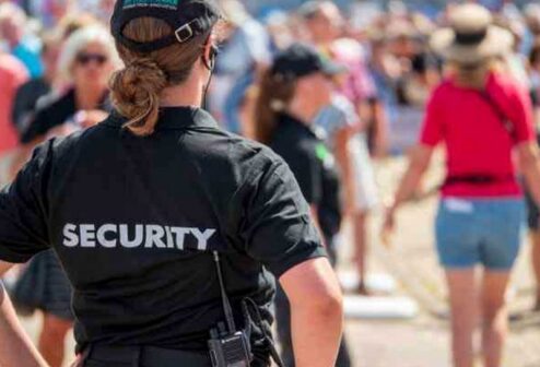 a-woman-in-a-security-uniform-at-an-event a-woman-in-a-security-uniform-at-an-event